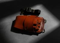 Orange leather holster with five scissor pockets