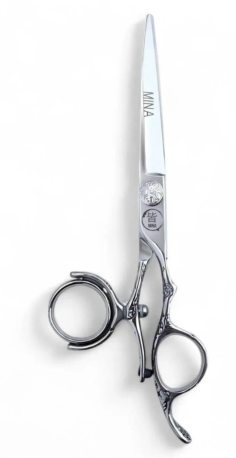 Complete Mina Sakura Double Swivel cutter with an engraved handle and a separate connector beside the thumb ring.